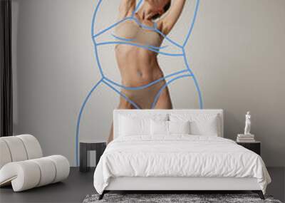 Portrait of slim woman in underwear wear posing isolated over gray studio background. Lines around body before losing weight. Wall mural