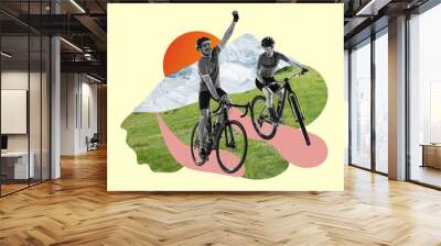 Riding a bicycle. Bw image of two professional cyclists, man and woman riding bicycles on grass among mountains Wall mural