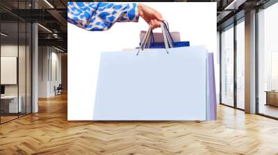 Sale offer. Black Friday. Shopping discount. Closeup of woman hand holding purchase blue bags against transparent background. Concept of shopping, cyber monday. copy space for ad Wall mural