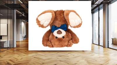 Friendly brown teddy bear with blue bow staying in handstand on white background. Photography for children's store Wall mural