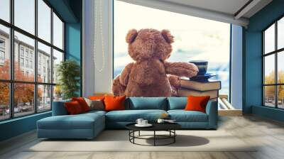 Sweet Teddy bear with cup of coffee. At a morning sun light. Good morning concept. Wall mural