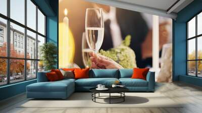 Alcohol, champagne and hands of people at party for celebration, social event and gathering. Friends, luxury restaurant and closeup of liquor for cheers, toast and drinks at new years eve gala Wall mural