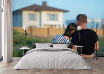 Couple looking at their home Wall mural