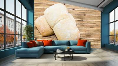 Two ciabatta bread on a bamboo rustic placemat Wall mural