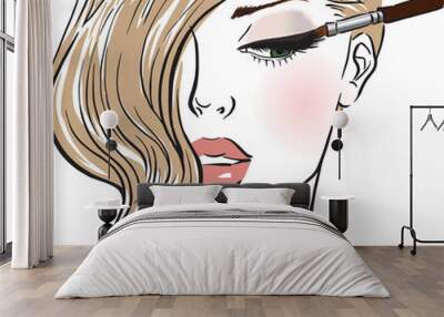 Beautiful girl with a makeup brush Wall mural