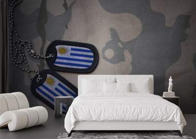 army blank, dog tag with flag of uruguay on the khaki texture background. military concept Wall mural