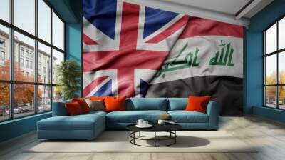 big waving national colorful flag of great britain and national flag of iraq . Wall mural