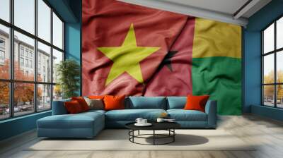 big waving realistic national colorful flag of vietnam and national flag of guinea bissau . Wall mural