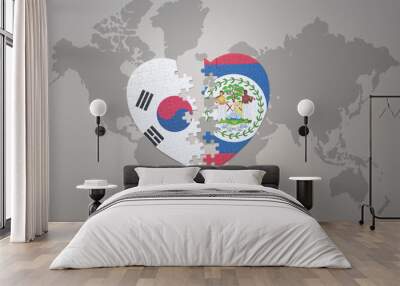 puzzle heart with the national flag of belize and south korea on a world map background. Concept. Wall mural