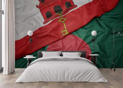 waving colorful flag of bangladesh and national flag of gibraltar. Wall mural