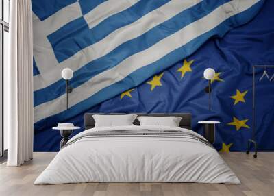 waving colorful flag of european union and national flag of greece. Wall mural