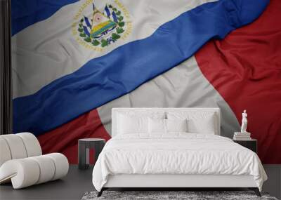 waving colorful flag of peru and national flag of el salvador. Wall mural