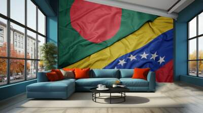 waving colorful flag of venezuela and national flag of bangladesh. Wall mural