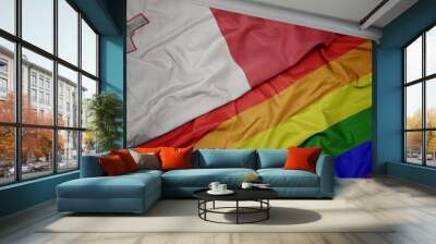 waving colorful gay rainbow flag and national flag of malta. Wall mural