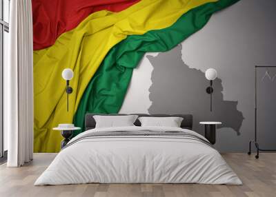 waving colorful national flag and map of bolivia. Wall mural