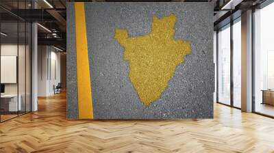 yellow map of burundi country on asphalt road near yellow line. Wall mural