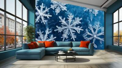 White snowflakes on the surface of dark blue ice winter background Wall mural