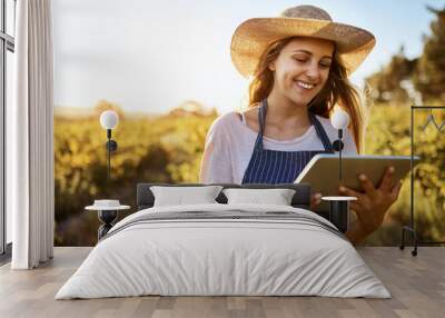 Tablet, farmer and happy woman online for agriculture research, sustainability or plant growth outdoor at field. Digital technology, farm or person at countryside for planning food production or agro Wall mural