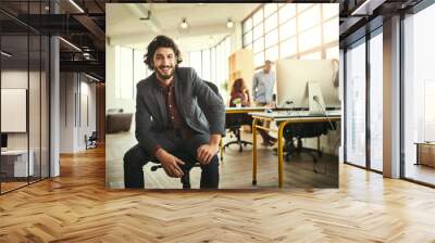 My innovation my increase productivity. Cropped portrait of a handsome young businessman sitting in the office with his colleagues in the background. Wall mural