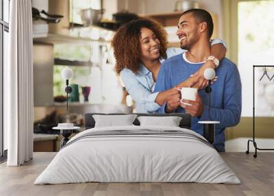 Honey, youre the best. Shot of a happy young couple feeling relaxed in the at home. Wall mural