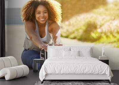 Stretch properly. Its worth it. Portrait of an attractive young woman warming up before her workout. Wall mural