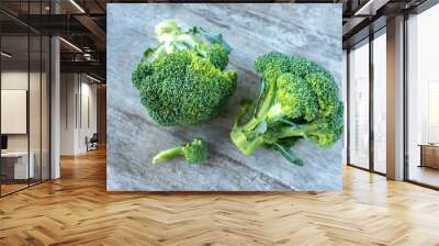 flat lay of two green broccoli crown heads Wall mural