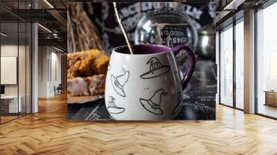 Witches hat mug drink in spooky Halloween setting Wall mural