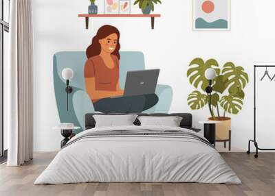 Young woman is relaxing on comfortable chair and using laptop. Сat is lying on the ottoman. Vector flat illustration Wall mural