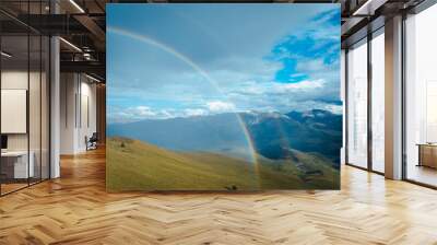 Beautiful  double rainbow after the rain on high altitude mountain top Wall mural