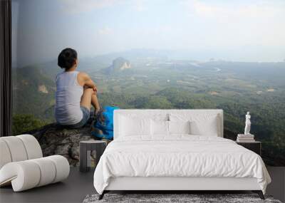 	woman hiker enjoy the view at sunset mountain peak cliff Wall mural