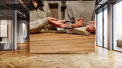 A person reads the Bible, embodying faith and spirituality. The scene reflects a serene moment of contemplation and devotion, highlighting the importance of religion in everyday life. Wall mural