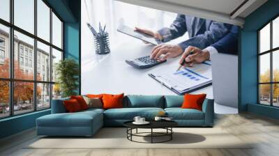 Using tablet pc, Consultant between bookkeepers and accounting lawyer consultation about asset, balance sheet, stock market statistics and yearly tax law, protect business from bribery. Wall mural