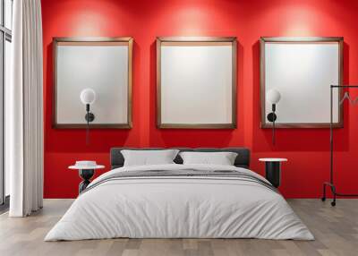 Artful display: three white art frames on a red wall, spotlighted to emphasize the blank space. Wall mural