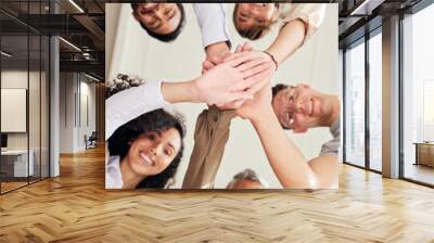 Teamwork, people portrait and hands together in support, collaboration or team building mission from below. Group, circle or business women and men, stacked hand sign and happy goals with diversity Wall mural