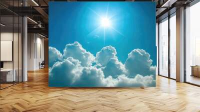 Bright sun illuminating fluffy clouds in a clear blue sky Wall mural