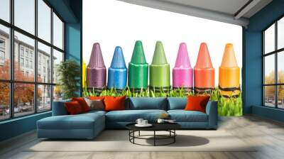 Colorful crayons on a grassy, isolated white background, with copy space for a children's day or back-to-school concept. Wall mural