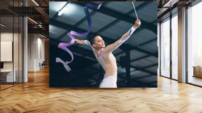 Ribbon gymnastics, woman and dancing in performance, training show and sports competition. Young female, rhythmic movement and elegant dancer in action, creative talent and energy for concert event Wall mural