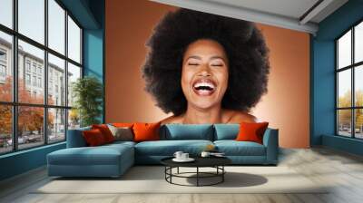 Black woman, skincare beauty and hair care model with healthy afro, natural cosmetics empowerment and happy laugh. Portrait of proud, confident and beautiful young African girl in studio background Wall mural