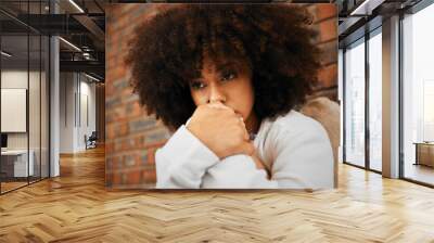 Fear, sad or depression of a young woman sitting with depressed expression or thinking of a problem. Worried and alone african American woman after a bad fail, anxiety or mental health issues Wall mural