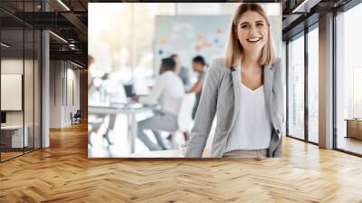 Portrait of a happy business manager and boss of a creative team of startup advertising designers. Proud, smiling businesswoman or leader feeling confident and happiness while working in the office Wall mural