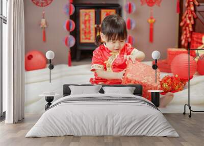 Chinese baby girl  traditional dressing up celebrate Chinese new year open gift box Wall mural