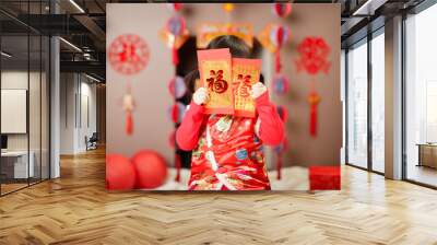 Chinese baby girl  traditional dressing up with a FU means lucky red envelope Wall mural