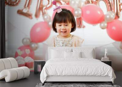 toddler girl celebrating her third birthday at home Wall mural