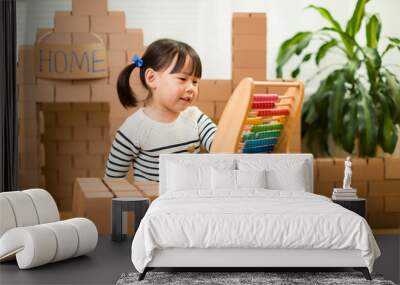 toddler girl learn counting by using abacus for homeschooling Wall mural