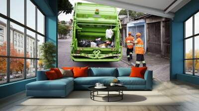 Garbage truck, dirt and people with collection service on street in city for public environment cleaning. Junk, recycling and men working with waste or trash for road sanitation with transport. Wall mural