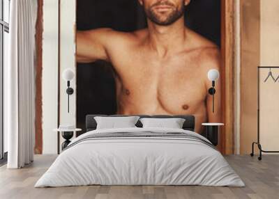 Hes a mans man. Cropped shot of a shirtless young man at home. Wall mural