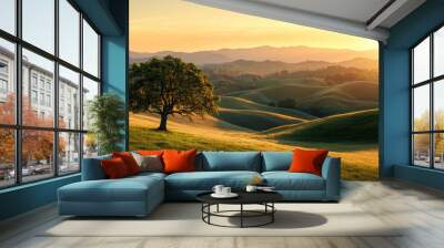 Serene landscape at sunset with rolling hills, an oak tree in the foreground, and warm golden sunlight illuminating the scene Wall mural