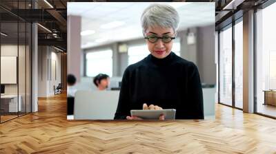 Senior businesswoman with eyeglasses, Asian older woman corporation ceo in modern office looking at camera. 60s gray-haired female executive leader Wall mural