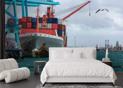 Tugboats and container ship moored at the dock Wall mural