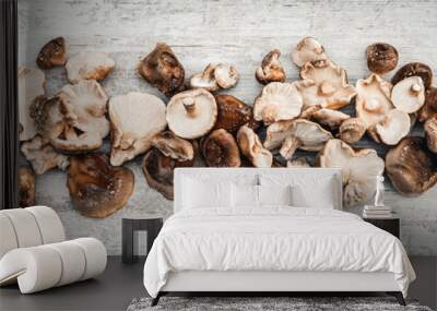 Topview panorama, lots of delicious shiitake mushrooms on wooden table Wall mural